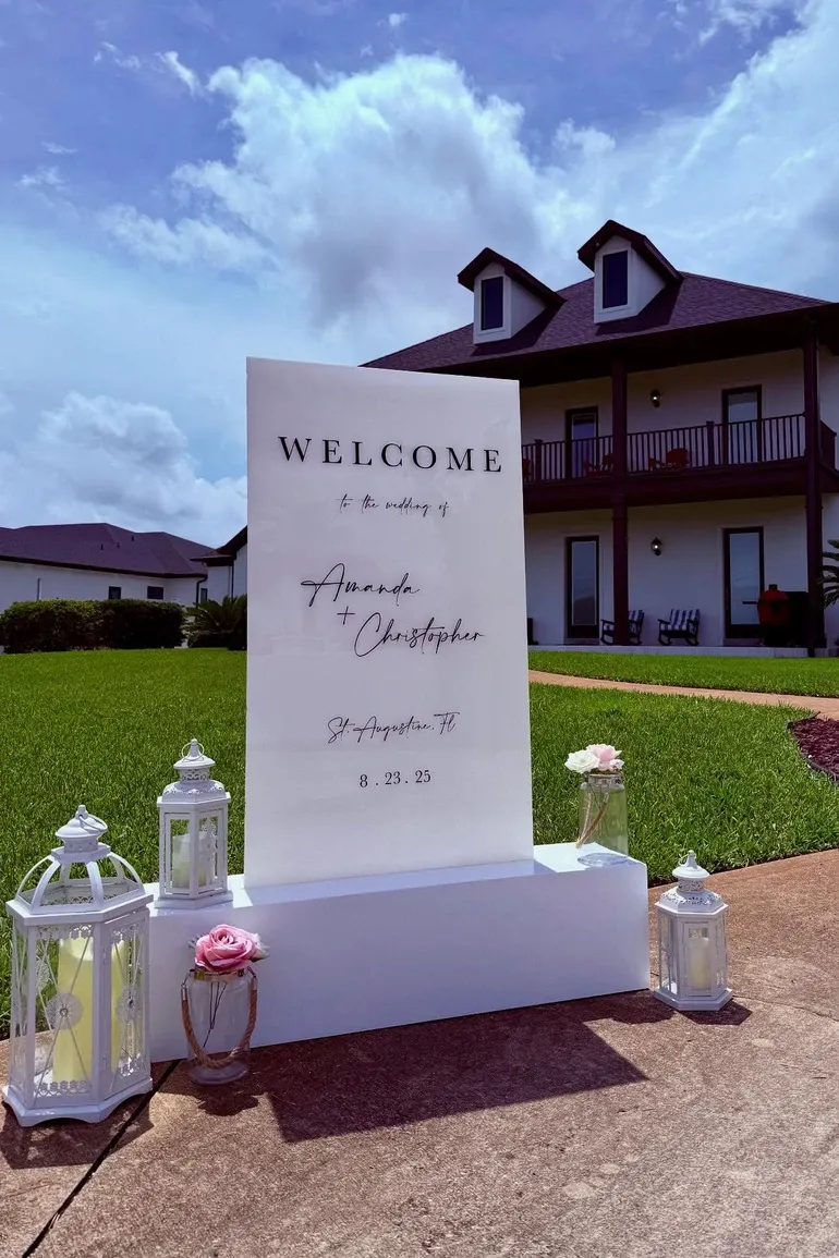 Welcome sign for Amanda and Christopher outside a country house