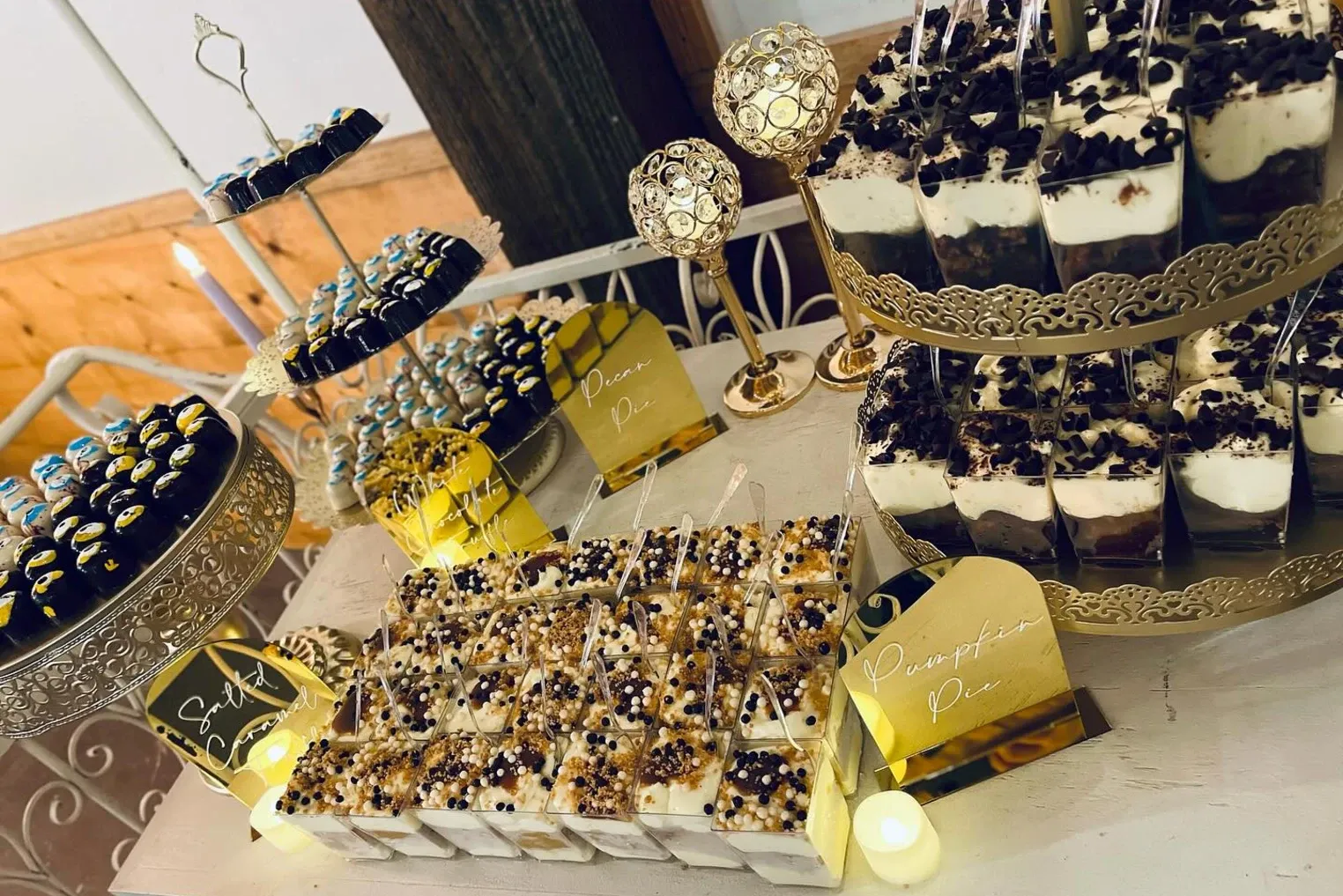 Gold and navy dessert bar with cupcakes and crispy treats