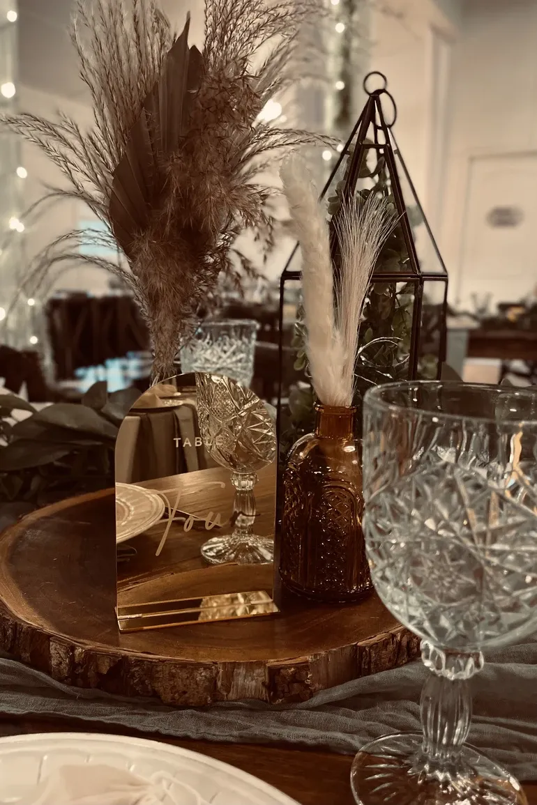 Pampas grass and amber glass centerpiece with lanterns