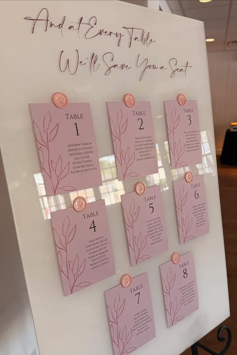 Blush seating chart cards sealed with wax