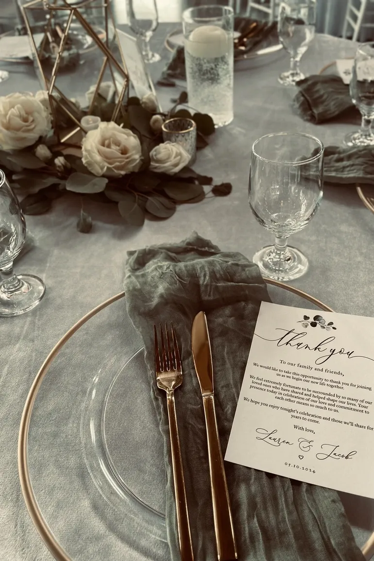 Silver and grey tablescape with roses and a thank you card