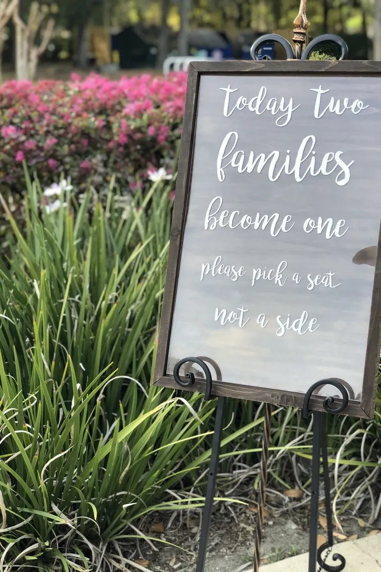 Pick a seat not a side sign framed by tall grasses