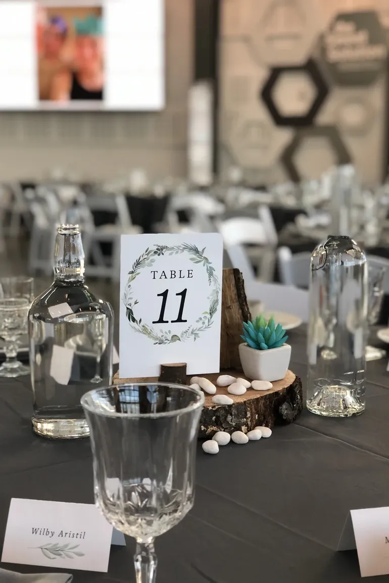 Table eleven card in a painted wreath with a succulent
