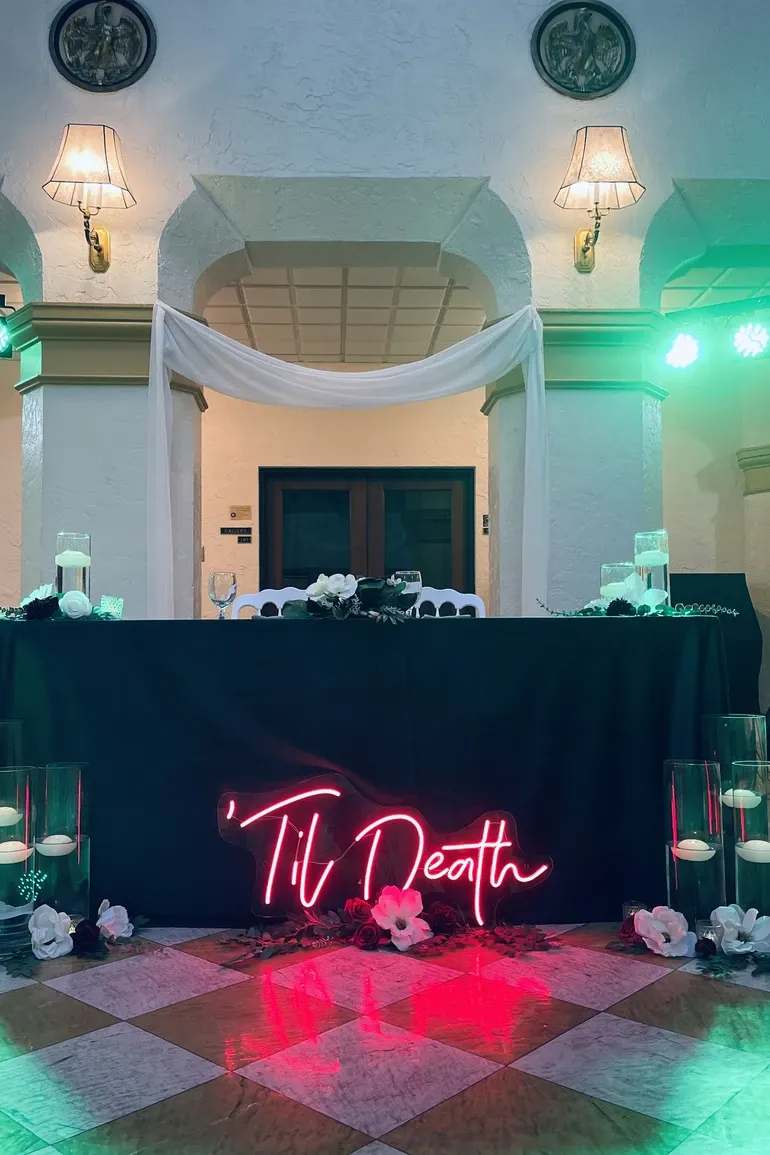 Venue entry draped in white fabric with candles