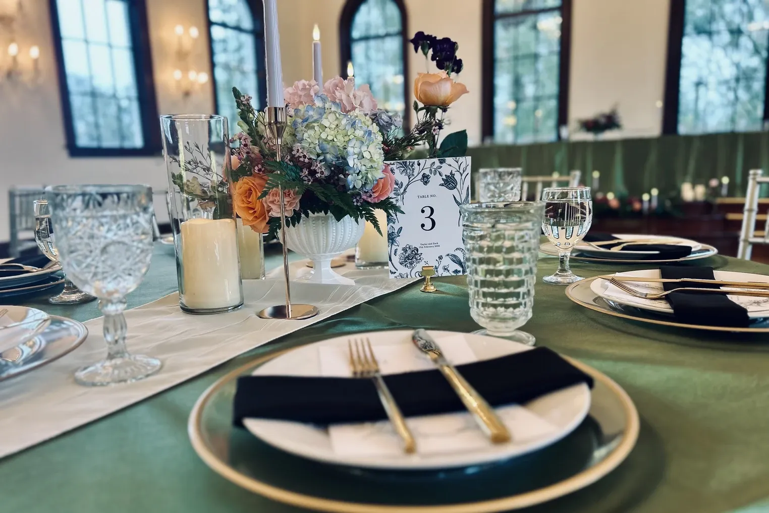 Sage green tablescape with hydrangeas and cut crystal